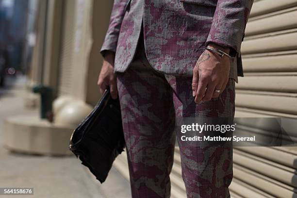 Julius LaCour is seen attending the Nick Graham, Kenneth Ning & John Elliott presentations wearing a suit and bag by his own design with Thom Browne...