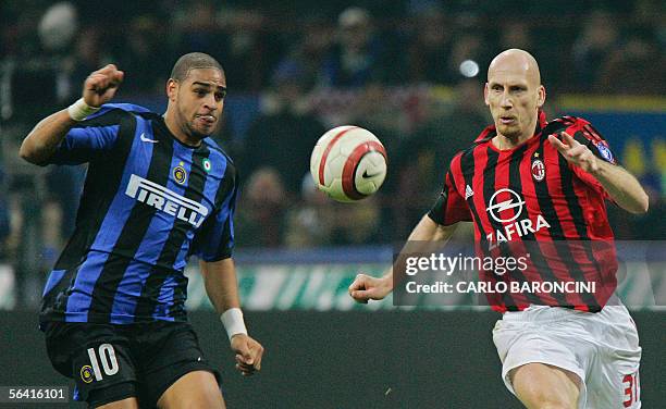 Inter Milan's forward Adriano of Brazil fights for the ball with AC Milan's defender Jaap Stam of Netherlands during their italian serie A football...
