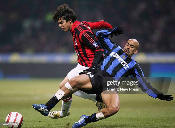 Kaka of Milan clashes with Juan Sebastian Veron of Inter during the Serie A match between Inter Milan and AC Milan played at the Giuseppe Meazza San...