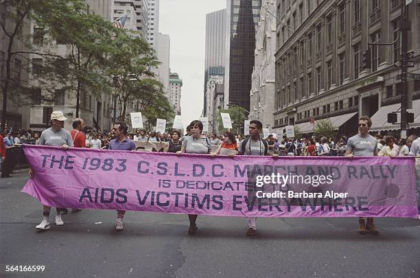 Members of the Christopher Street Liberation Day Committee carry a banner through a street in New York City, USA, June 26, 1983.