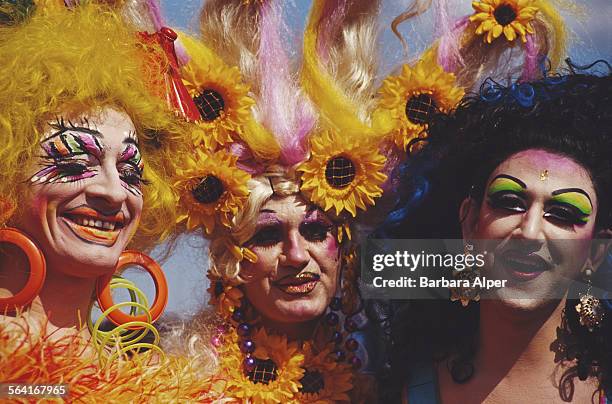 Men wearing wigs and make-up enjoy themselves at the Wigstock festival, New York City, USA, August 1994.