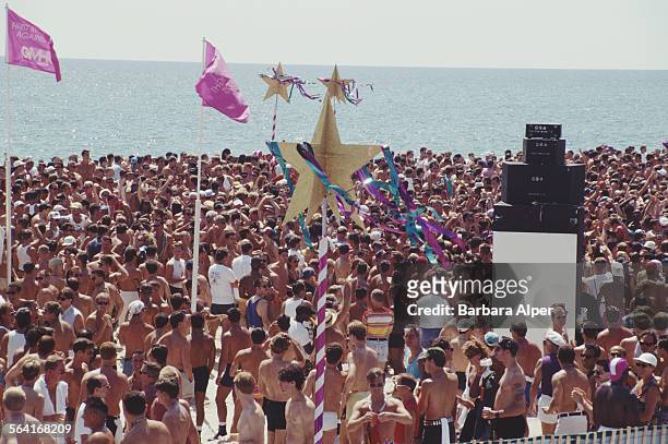 People enjoy themselves at the Wigstock festival, West Side Piers, New York City, USA, August 1993.