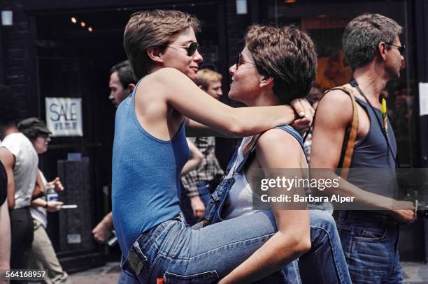 Two women embrace during the Gay Pride parade in New York City, USA, June 27, 1982.