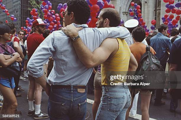 Two men watching the Gay Pride parade in New York City, USA, June 23, 1984.