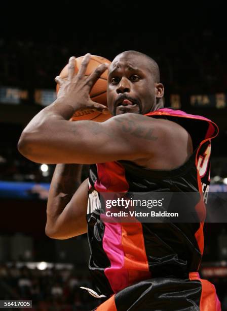 Shaquille O'Neal of the Miami Heat grabs a rebound against the Washington Wizards on December 11, 2005 at American Airlines Arena in Miami, Florida....