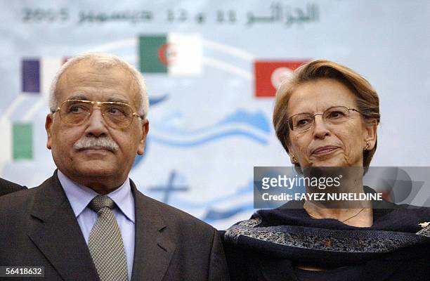 Algerian defence minister Abdelmalek Guenaizia and his French counterpart Michele Alliot-Marie pose after the end of a meeting in Algiers 12 December...
