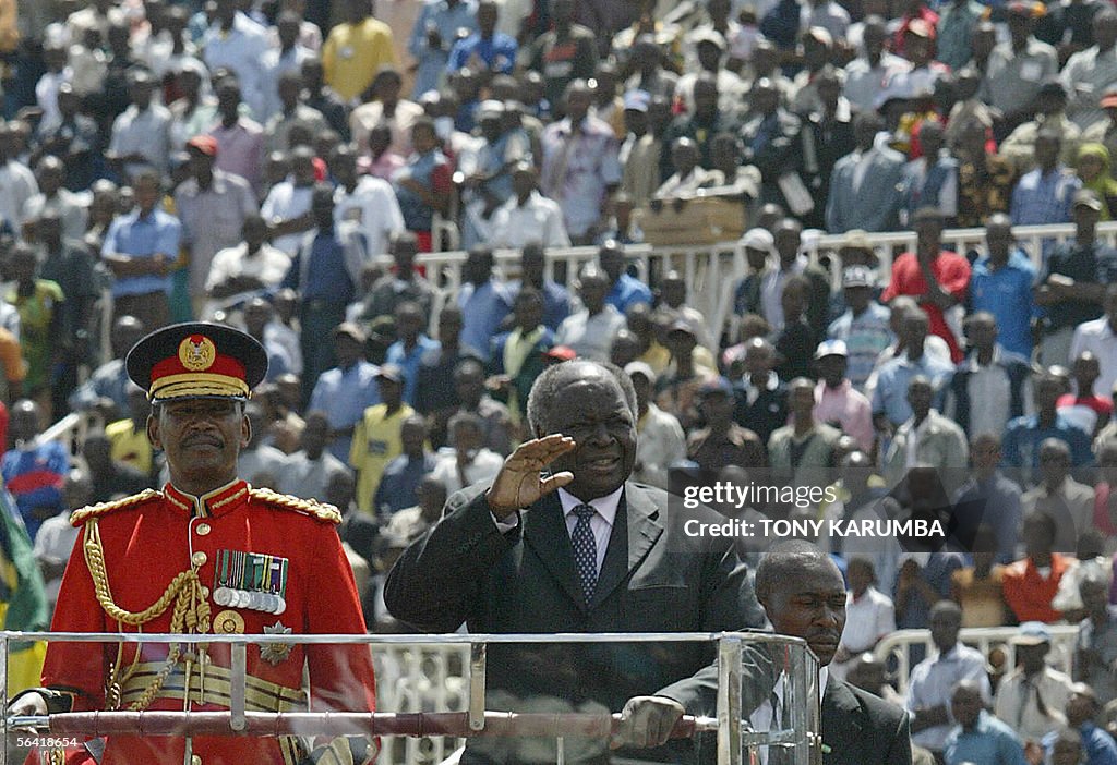 Kenyan President, Mwai Kibaki waves as h