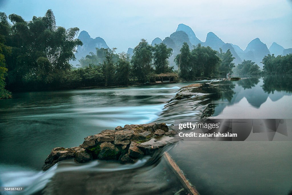 Li River at dawn with mountains in the background, Guilin, China
