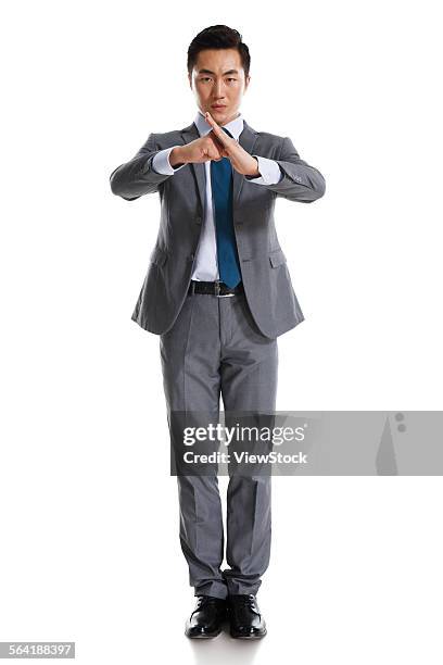 a young business man practicing kung fu - kung fu pose stock pictures, royalty-free photos & images