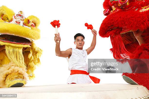the drums and the lion dance - bedug stock pictures, royalty-free photos & images