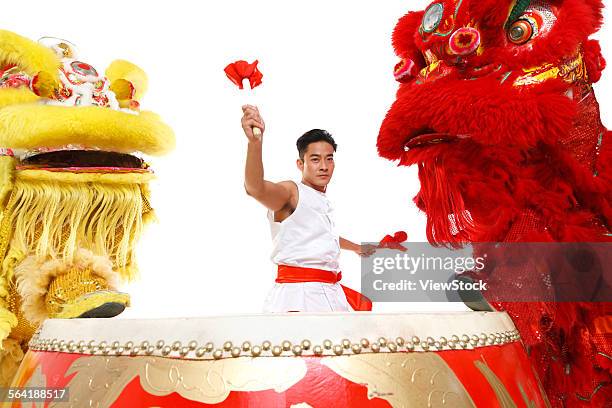 the drums and the lion dance - bedug stock pictures, royalty-free photos & images