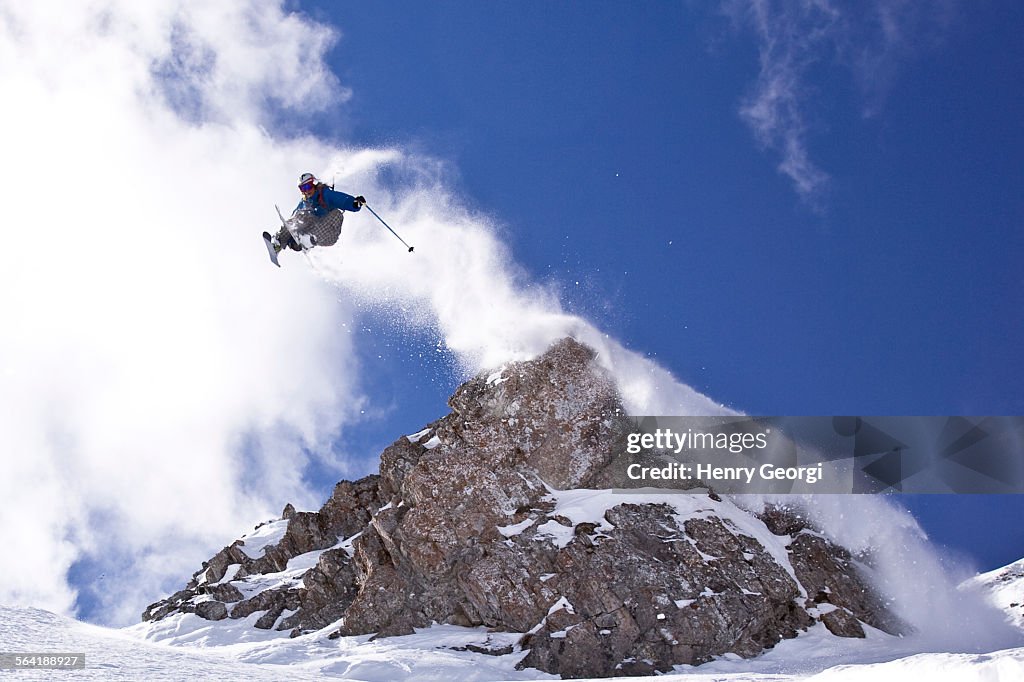 Young man catches huge air while skiing at Island Lake Resort, Fernie, BC, Canada.