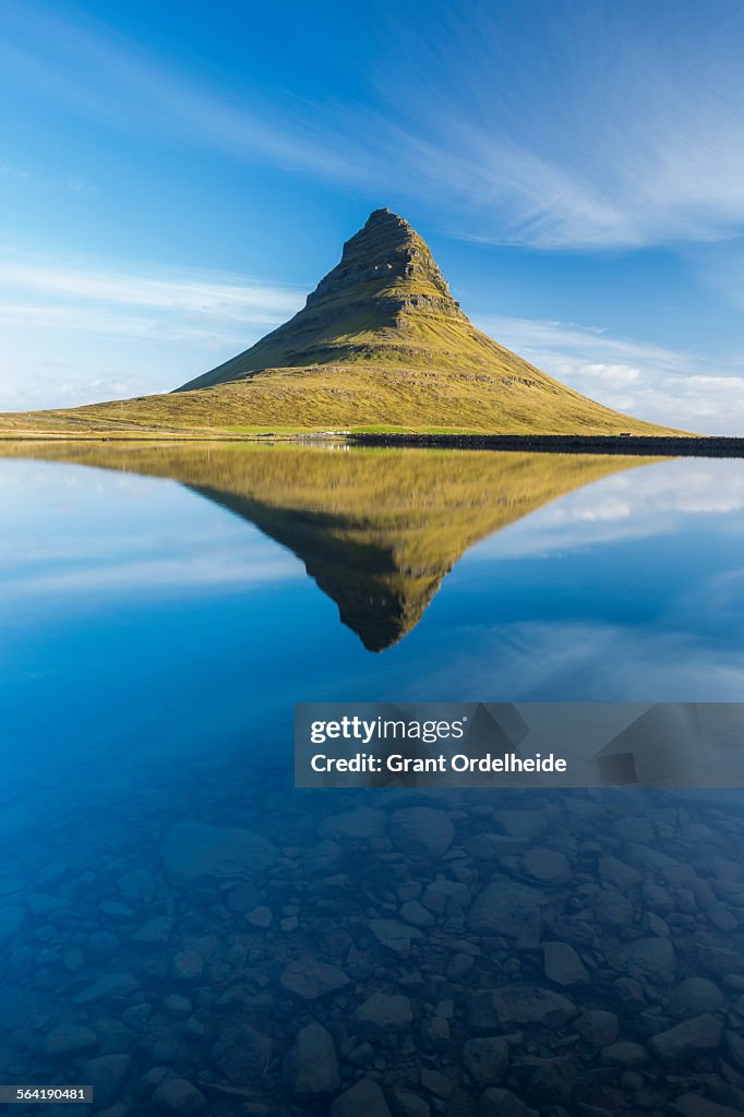 Kirkjufell mountain reflected in a small pond in western Iceland.