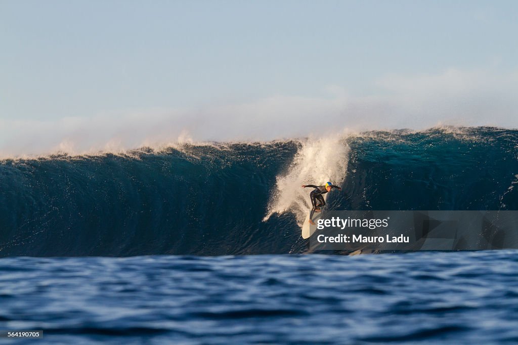 Man a professional big wave surfer at El Quemao wave in Lanzarote, Canary Islands. Spain.