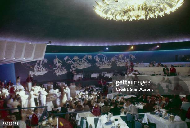 Guests in the dining room of the Fontainebleau Hotel, Miami Beach, Florida, 1955.