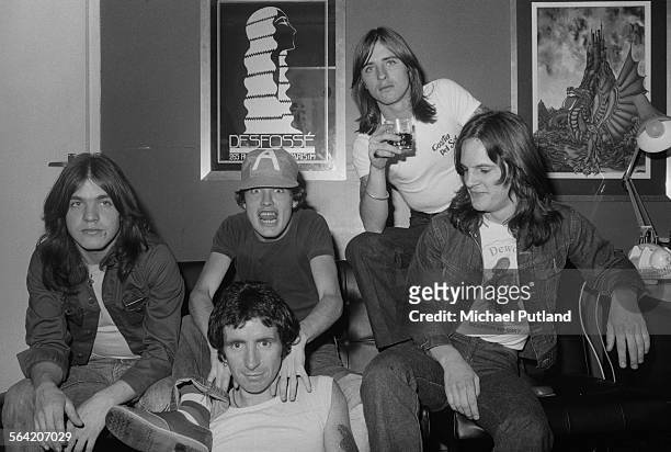 Australian hard rock group AC/DC, London, 8th April 1976. Left to right: rhythm guitarist Malcolm Young, singer Bon Scott , lead guitarist Angus...