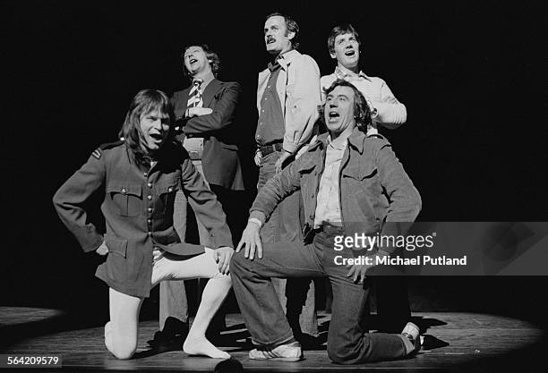 British comedy group Monty Python performing on stage at the New York City Center, New York, 20th April 1976. Left to right: Terry Gilliam, Graham...