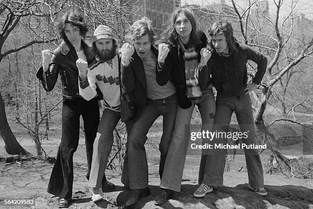 English progressive rock group Genesis in Central Park, New York City, 20th April 1976. Left to right: guitarist Steve Hackett, singer Phil Collins,...