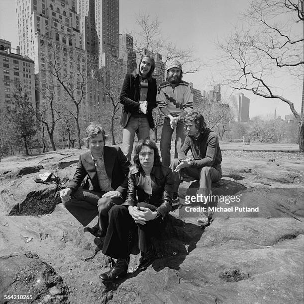English progressive rock group Genesis in Central Park, New York City, 20th April 1976. Clockwise from front, centre: guitarist Steve Hackett,...