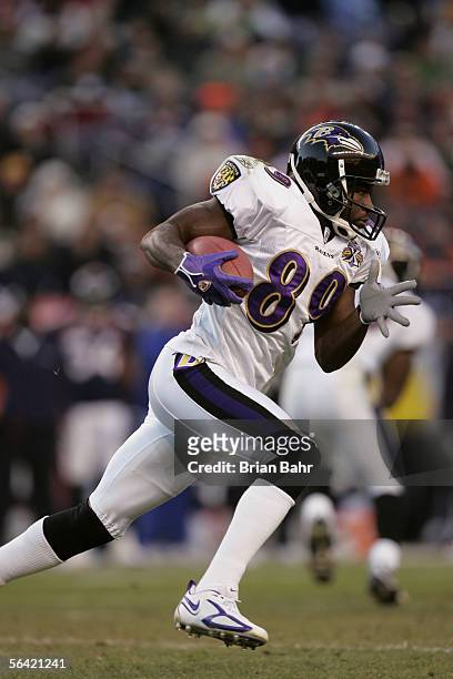 Wide receiver Mark Clayton of the Baltimore Ravens carries the ball against the Denver Broncos during the game on December 11, 2005 at Invesco Field...