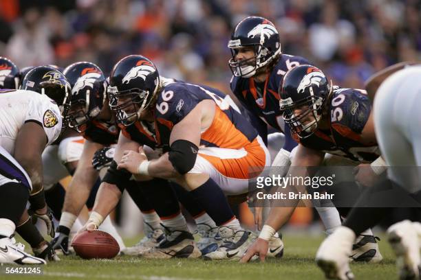 Quarterback Jake Plummer of the Denver Broncos waits for the snap from center Tom Nalen during the game against the Baltimore Ravens on December 11,...