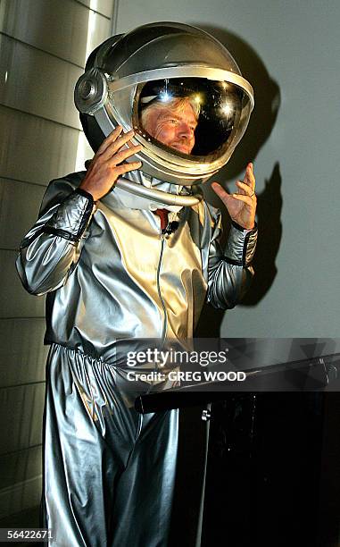 Richard Branson arrives in a space suit for the announcement in Sydney, 13 December 2005, of Australia's first private astronauts to sign up for the...