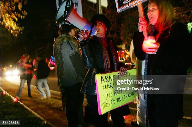 Protesters gather near the home of California Governor Arnold Schwarzenegger after the governor denied clemency for convicted killer Stanley...