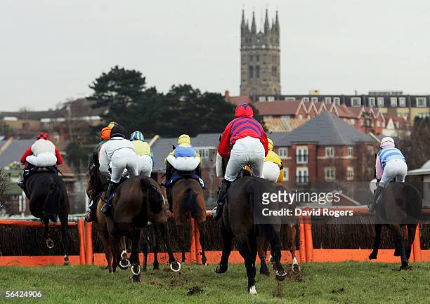The field clear a flight during the Ron Gascoigne Amateurs Novices Handicap Hurdle race held at Warwick Racecourse on December 13, 2005 in Warwick,...
