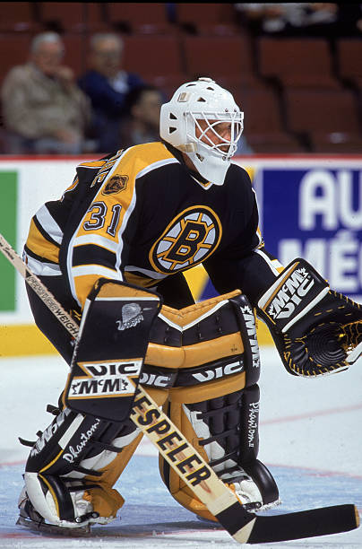 canadian-professional-hockey-player-tim-cheveldae-goalie-for-the-boston-bruins-crouches-in.jpg