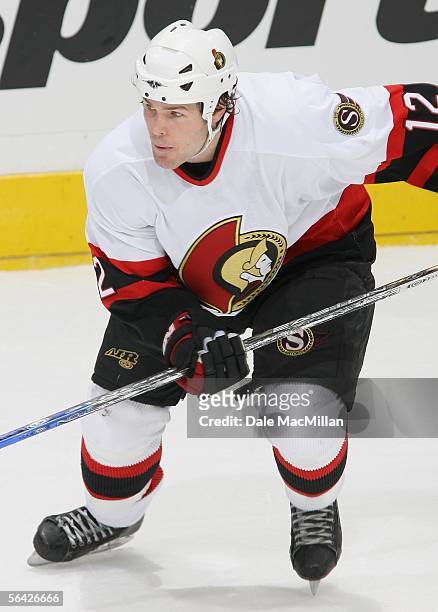 Mike Fisher of the Ottawa Senators skates against the Calgary Flames during the NHL game at Pengrowth Saddledome on December 10, 2005 in Calgary,...