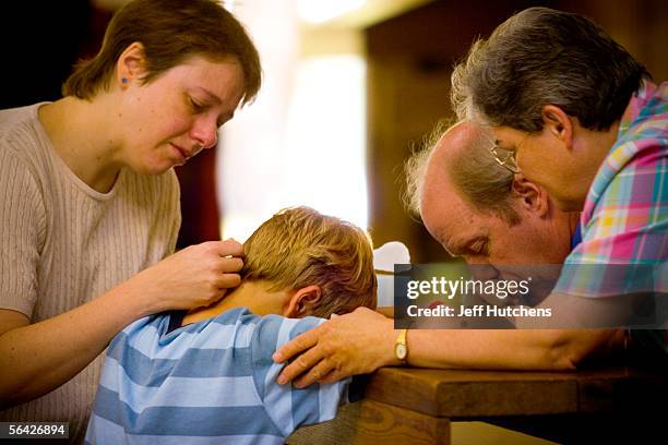 Child is prayed over during a healing service at Eaton Rapids Campmeeting on July 30, 2005 in Eaton Rapids, Michigan. The mission of Eaton Rapids...