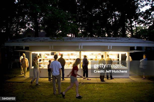 Campmeeting folks swarm around the book store after one of the evening services ended during Eaton Rapids Campmeeting on July 30, 2005 in Eaton...