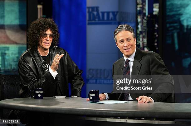 Radio personality Howard Stern talks with Jon Stewart during "The Daily Show With Jon Stewart" at the Daily Show Studios December 13, 2005 in New...
