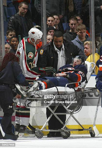 Jason Blake of the New York Islanders is taken off the ice after being injured in the third period against the Minnesota Wild on December 13, 2005 at...