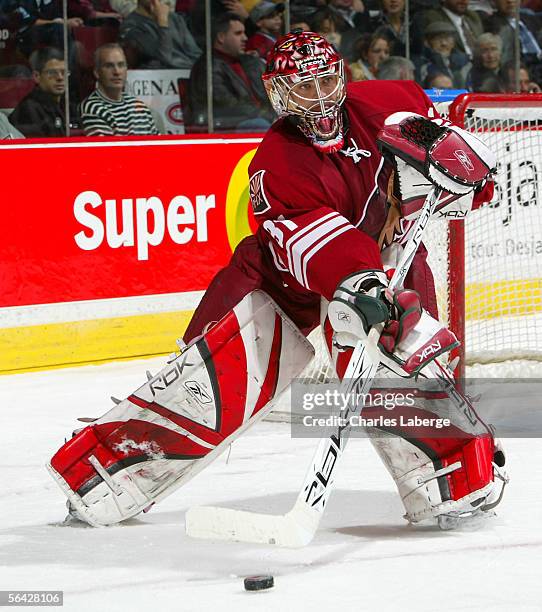 Goalie Curtis Joseph of the Phoenix Coyotes clears the puck against the Montreal Canadiens at the Bell Centre December 13 , 2005 in Montreal, Canada.