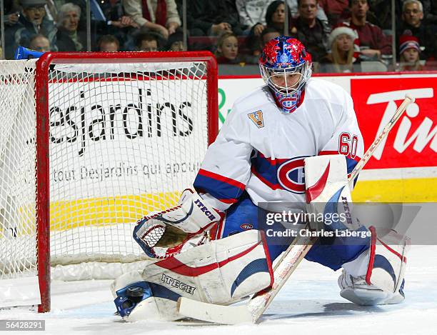 Goalie Jose Theodore of the Montreal Canadiens makes a pad save against the Phoenix Coyotes during NHL action at the Bell Centre on December 13 ,...