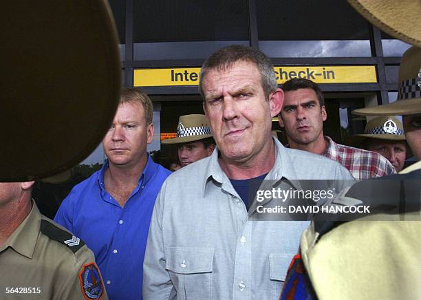 Bradley John Murdoch surrounded by police arrives at Darwin airport from Adelaide 24 November 2003. One of Australia's most enduring crime mysteries...