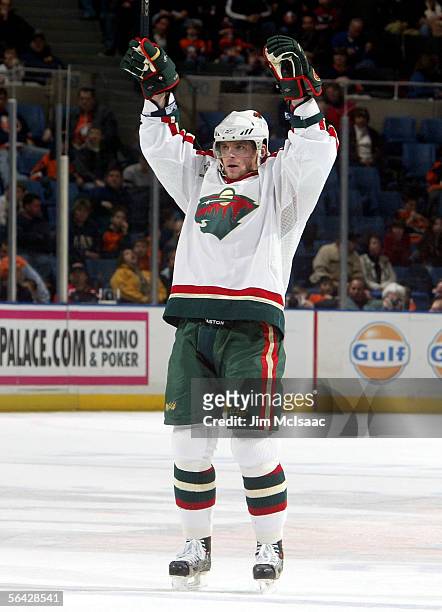 Marian Gaborik of the Minnesota Wild celebrates his second goal against the New York Islanders on December 13, 2005 at Nassau Coliseum in Uniondale,...