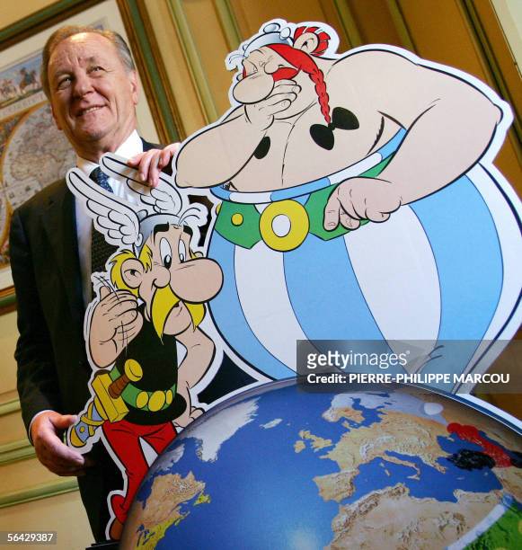 French cartoonist Albert Uderzo poses during the presentation of his new comic in Spanish language Asterix and Obelix's "El cielo se nos cae encima"...