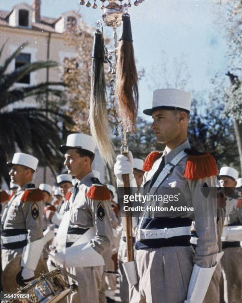 View of the standard bearer in a Foreign Legion parade outside of the Legion's headquarters in Sidi Bel Abbes, Algeria, 1940s.