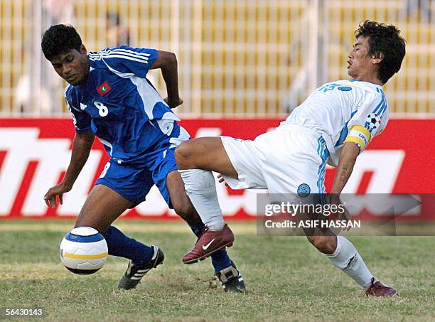 Maldives soccer player Jameel Mohamed vies with Indian player Bhaichung Bhutia during a semi-final match of the South Asian Football Federation Cup...