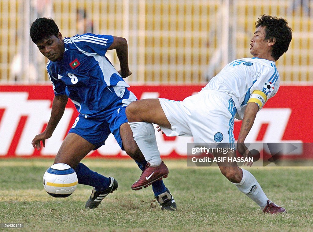 Maldives soccer player Jameel Mohamed (L