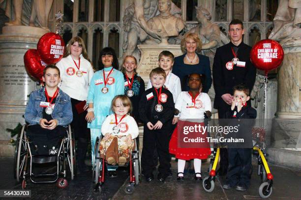 Camilla, Duchess of Cornwall with the Woman's Own 'Children of Courage Awards' winners on December 14, 2005 in London, England. The Duchess presented...