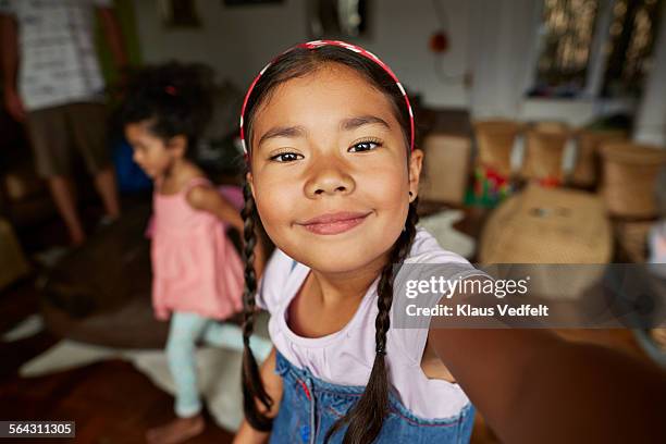 cute girl making selfie in living room - girl selfie stock pictures, royalty-free photos & images