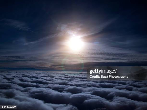 night view of moon over clouds from aircraft - clouds black background stock pictures, royalty-free photos & images