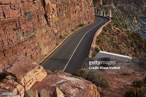 empty mountain road at chapman's peak - chapmans peak stock pictures, royalty-free photos & images