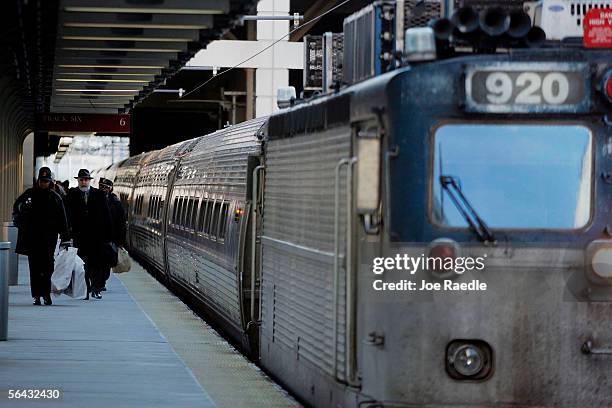 Passengers depart from an Amtrak train at South Station December 14, 2005 in Boston, Massachusetts. The Transportation Security Administration...