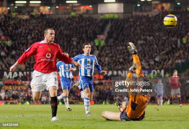 Wayne Rooney of Manchester United scores the third goal during the Barclays Premiership match between Manchester United and Wigan Athletic at Old...