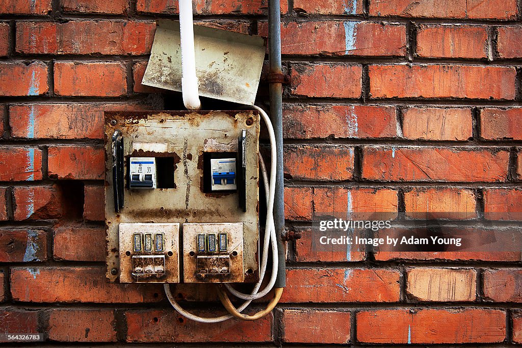 Rusted electricity box in disrepair