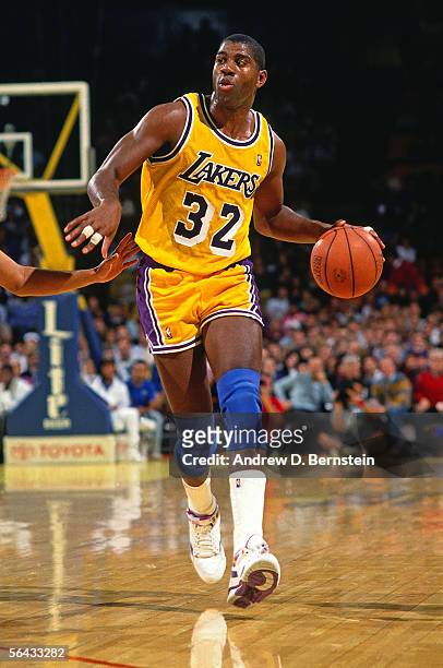 Magic Johnson of the Los Angeles Lakers dribble drives to th ebasket during the NBA game at the Forum circa 1991 in Inglewood, California. NOTE TO...